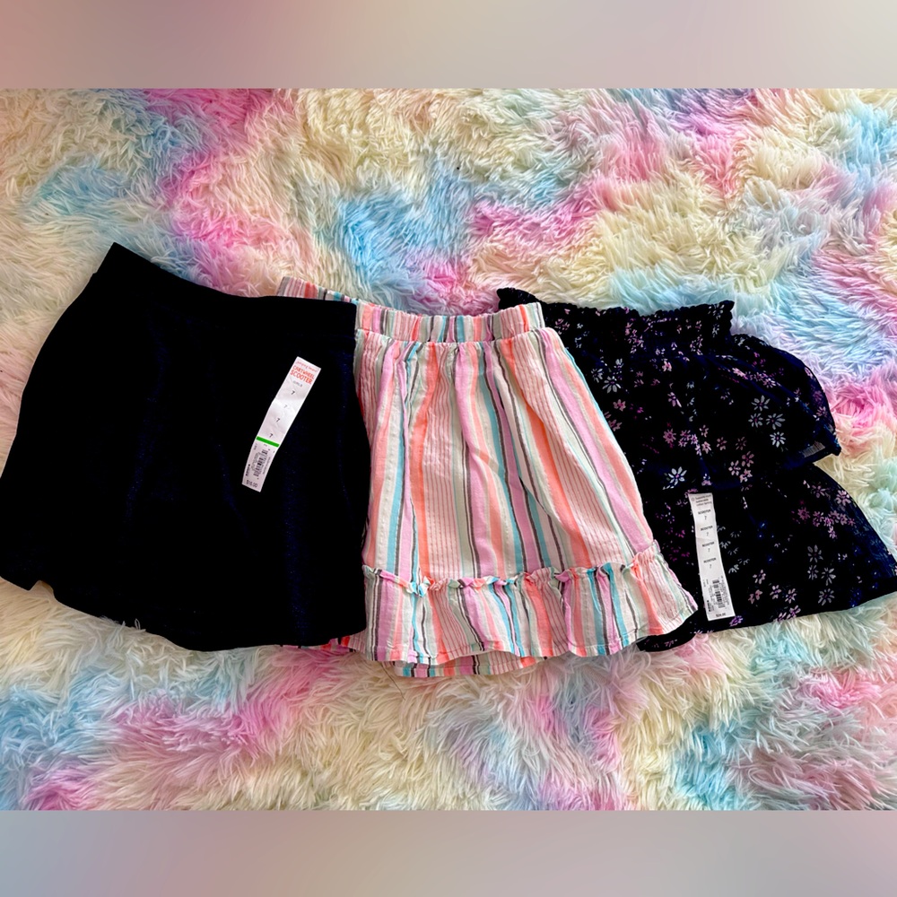Three new with tags girl skirts/skirts size 7